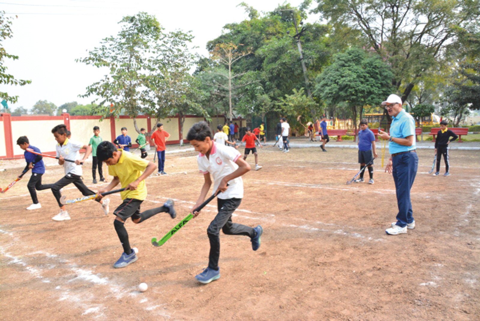 Student extracurricular activities with sports on school field and arts